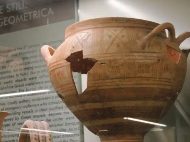 Swastika cross with four small circles painted on a vase